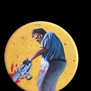 BADGE MASSACRE A LA TRONCONNEUSE