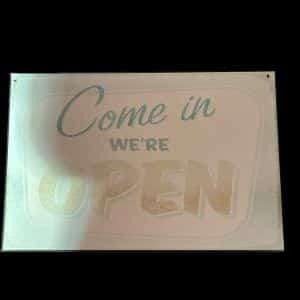 PLAQUE COME IN WE'RE OPEN